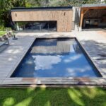 Piscine moderne avec fond mobile réalisée par Dodin Piscine